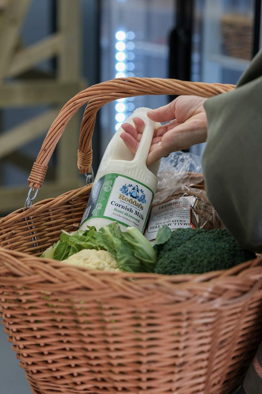 Cornish milk and fresh vegetables in basket
